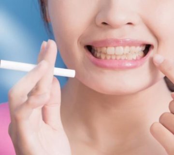 What are the harmful effects of smoking on teeth?
