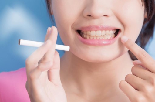 What are the harmful effects of smoking on teeth?