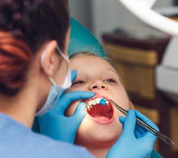 What is the importance of fluoride therapy for children?