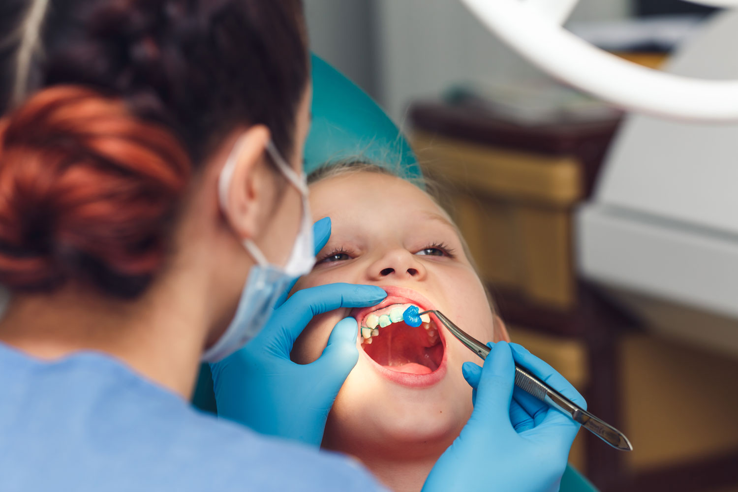 What is the importance of fluoride therapy for children?