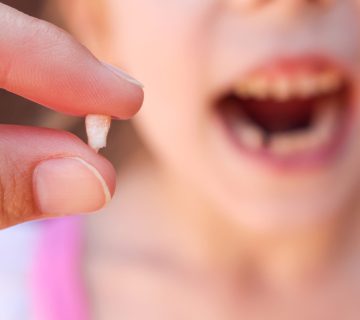At what age do baby molars fall out?